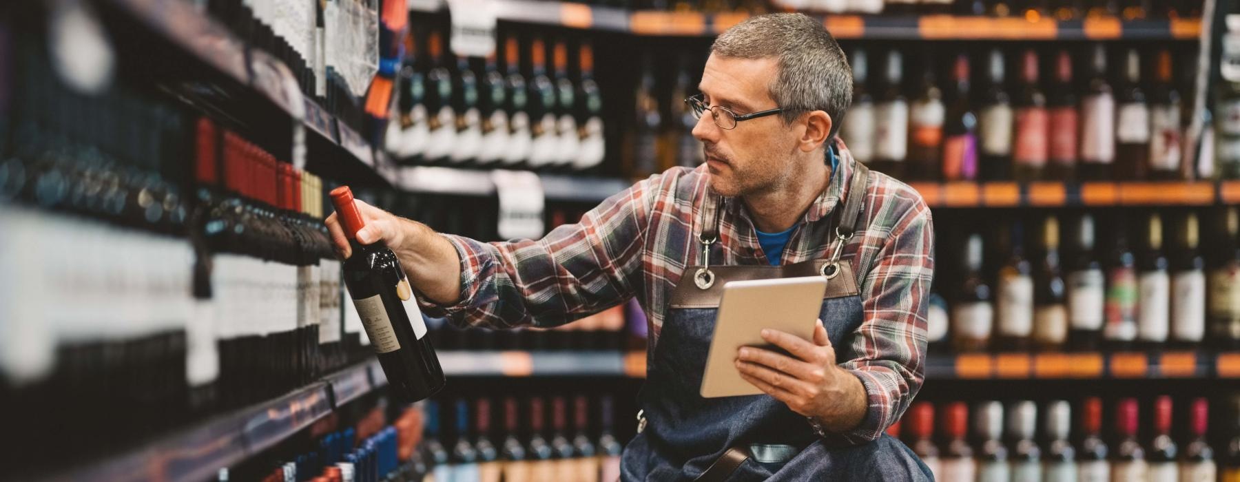 a man holding a microphone and a book in a store